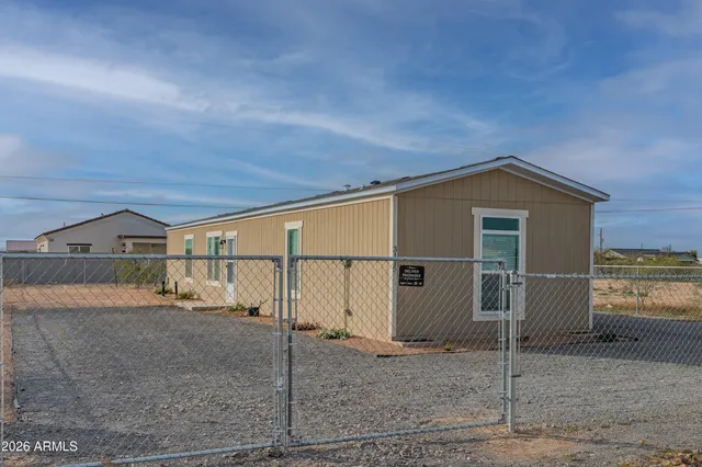 a view of a house with a yard and garage