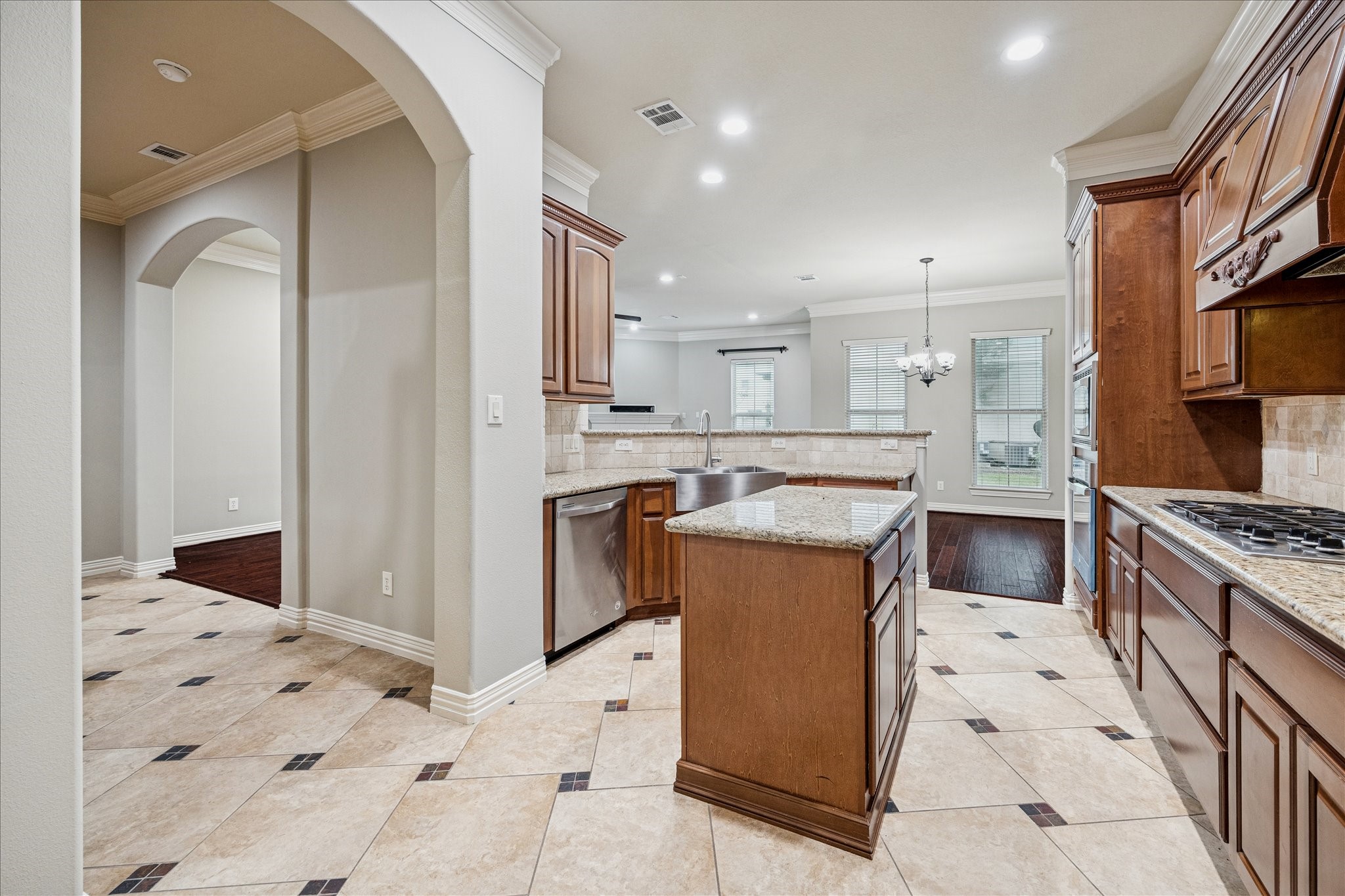 2 Schwab Lane Houston, TX 77055 - Photo 15 of 27 a kitchen with a stove a sink and a refrigerator