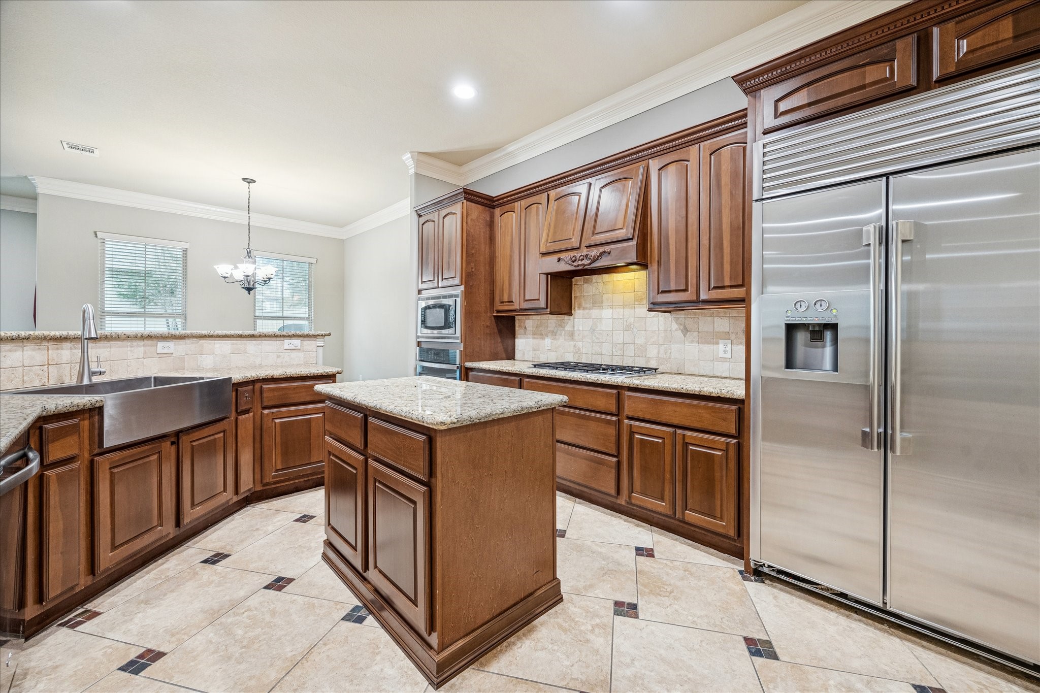 2 Schwab Lane Houston, TX 77055 - Photo 3 of 27 a kitchen with stainless steel appliances granite countertop a sink and cabinets