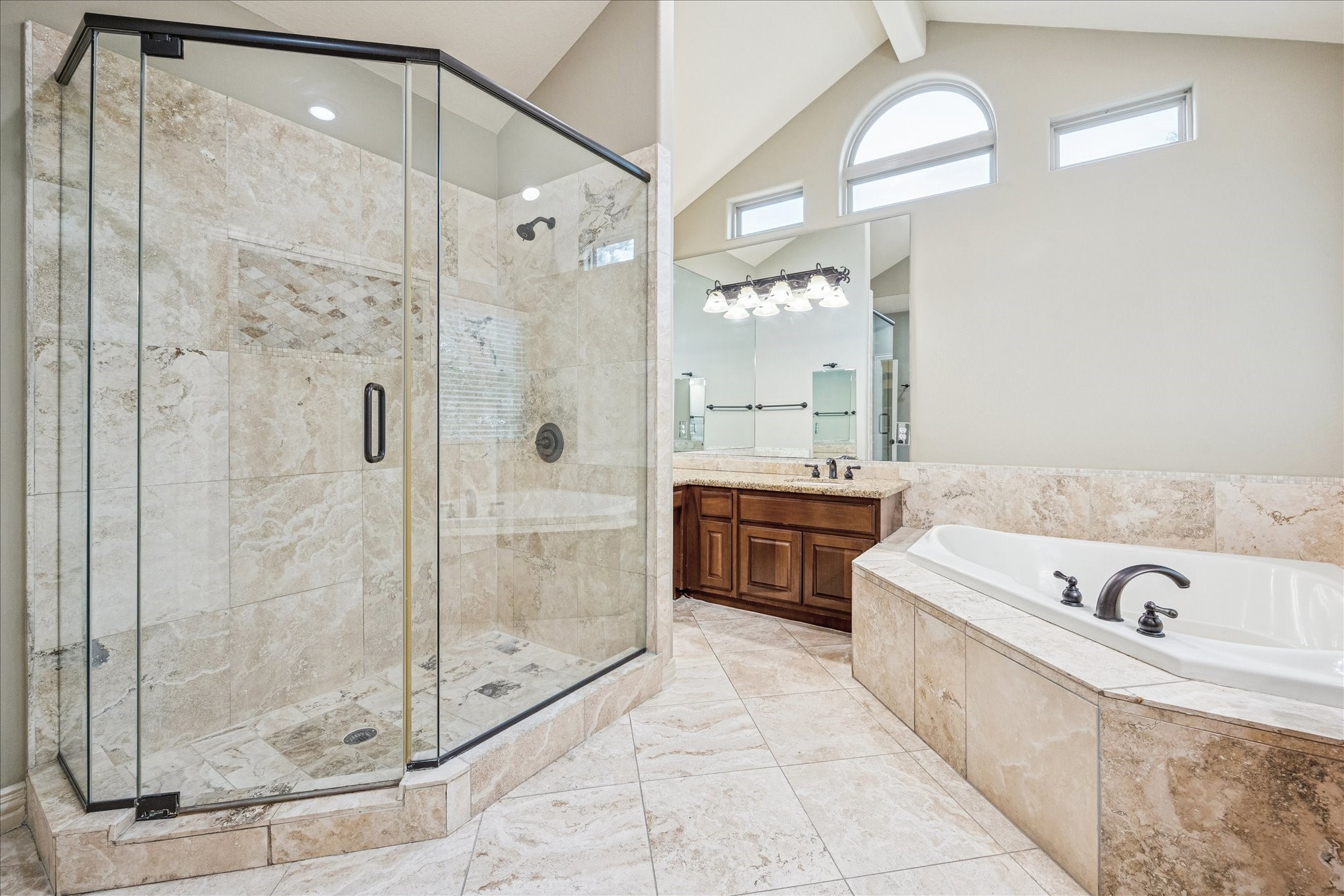 2 Schwab Lane Houston, TX 77055 - Photo 6 of 27 a bathroom with a tub a sink and a mirror