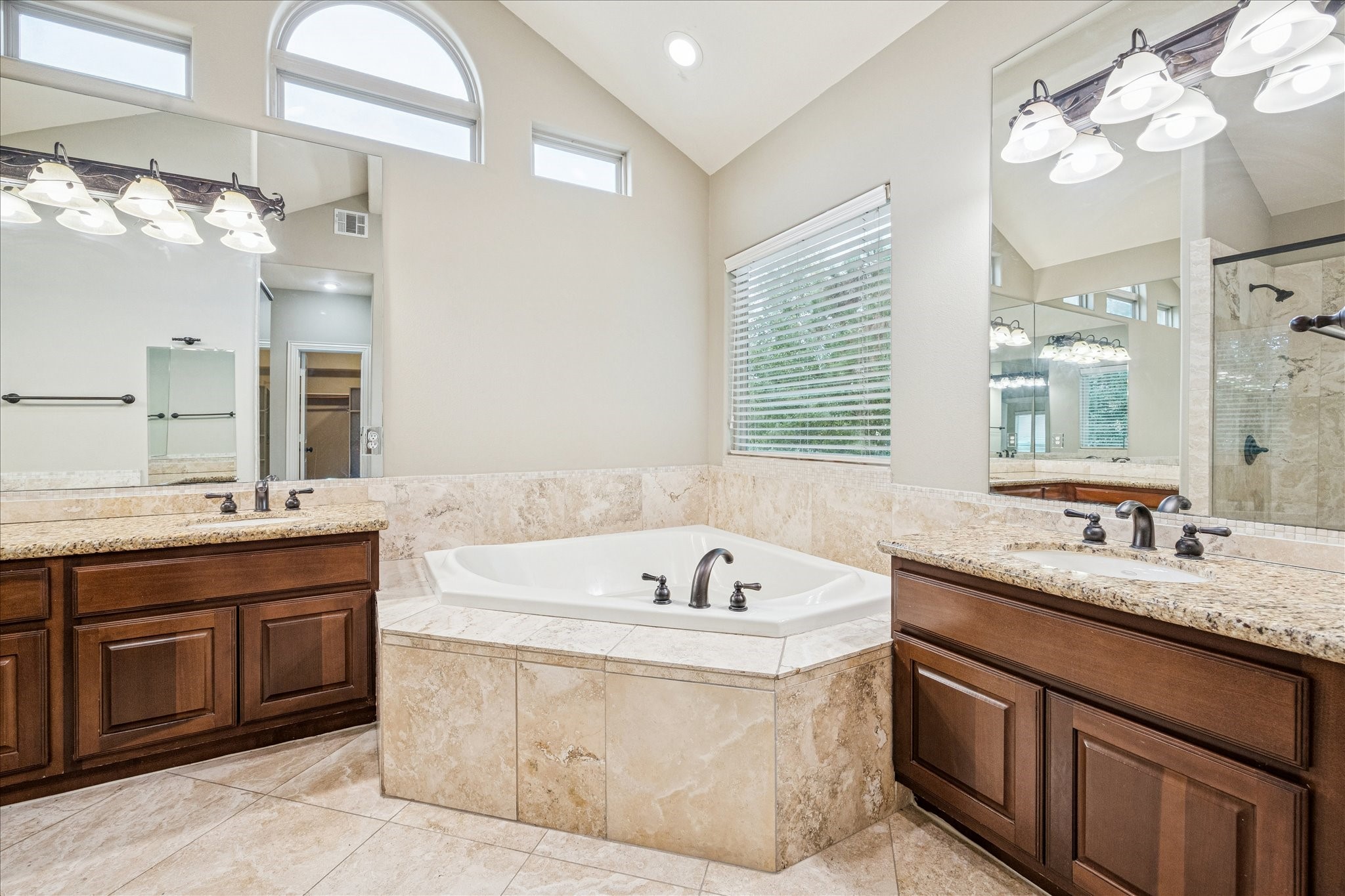 2 Schwab Lane Houston, TX 77055 - Photo 7 of 27 a spacious bathroom with a tub sink and mirror
