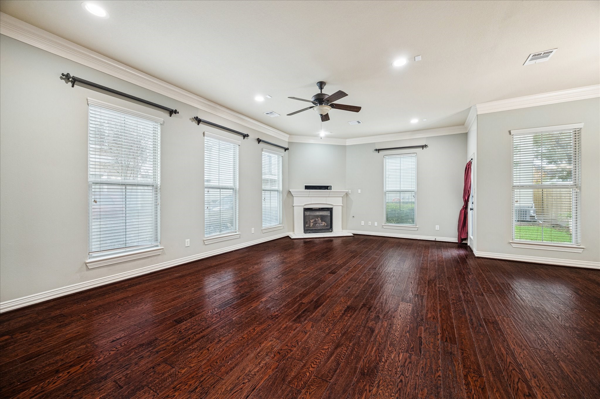 2 Schwab Lane Houston, TX 77055 - Photo 8 of 27 a view of empty room with wooden floor and fan