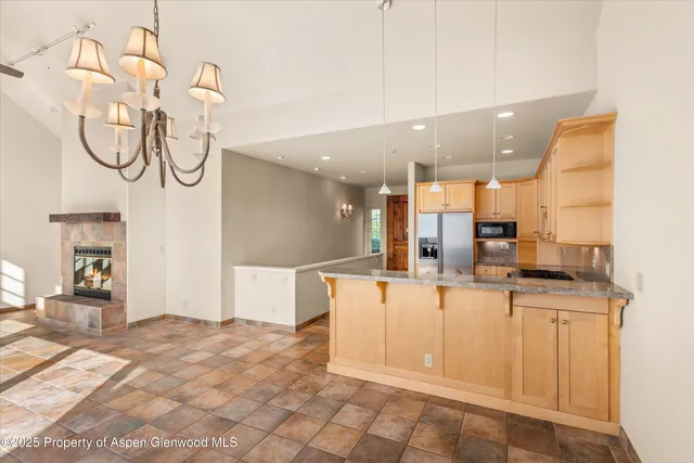 a large white kitchen with a sink and cabinets