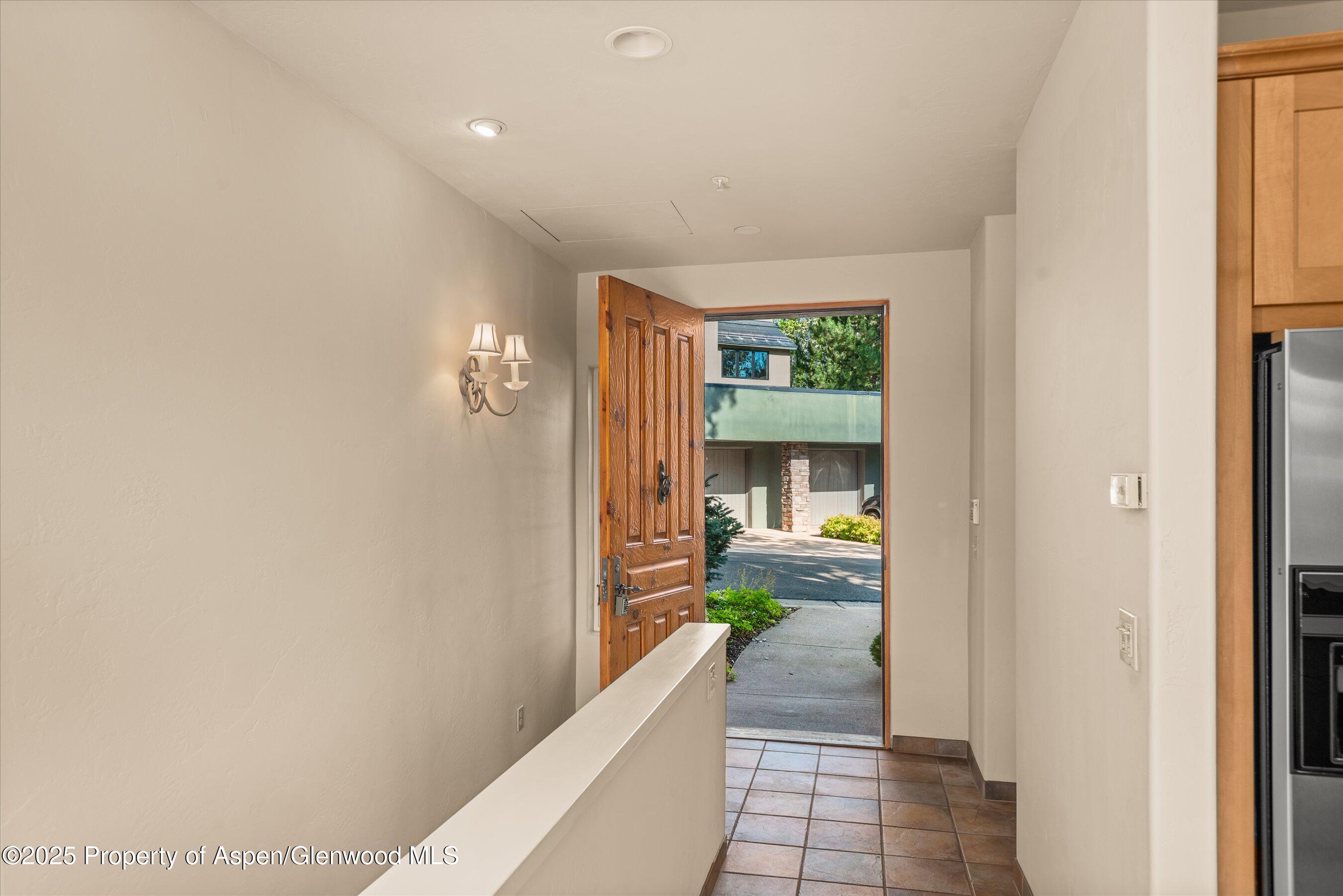 404 Wild Spring Lane Basalt, CO 81621 - Photo 28 of 30 a view of a hallway view with wooden floor and living room