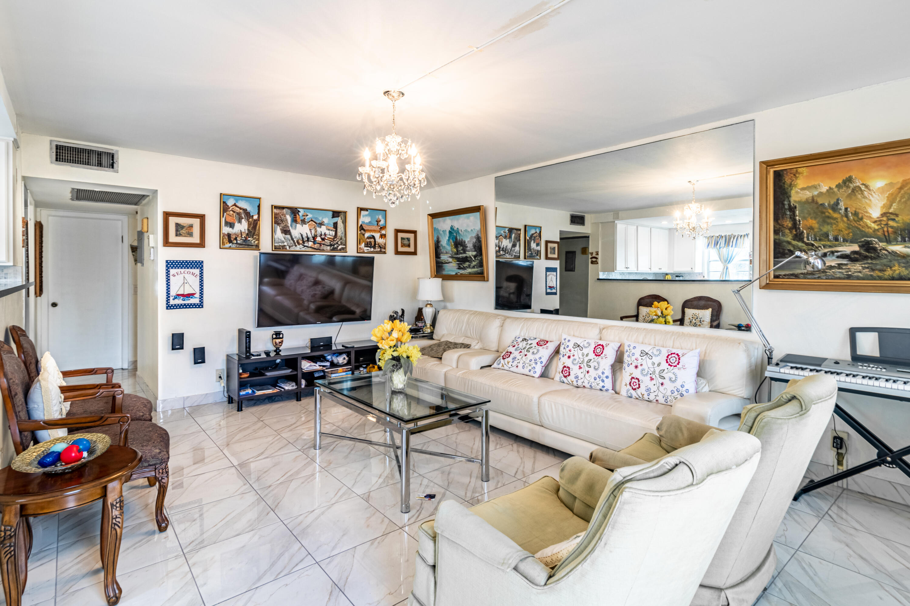 a living room with furniture and a flat screen tv