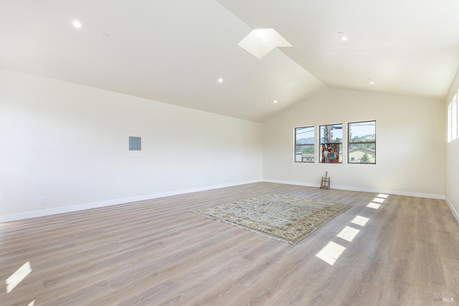 753 Sunnyside Road St. Helena, CA 94574 - Photo 35 of 55 an empty room with wooden floor and windows
