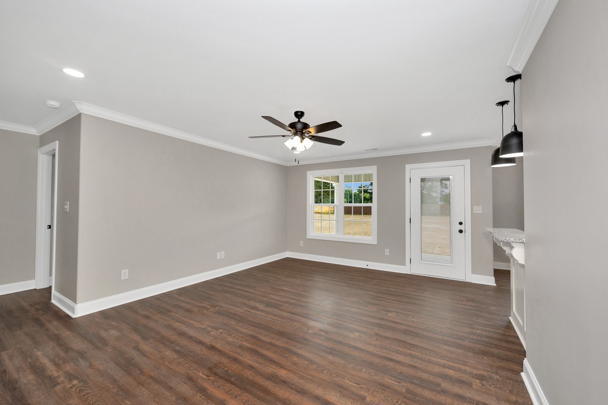 27025 North Wales Road Elkmont, AL 35620 - Photo 12 of 40 a view of an empty room with wooden floor and a window
