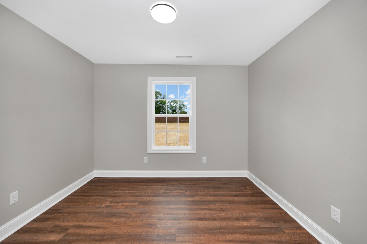 27025 North Wales Road Elkmont, AL 35620 - Photo 24 of 40 a view of an empty room with wooden floor and a window