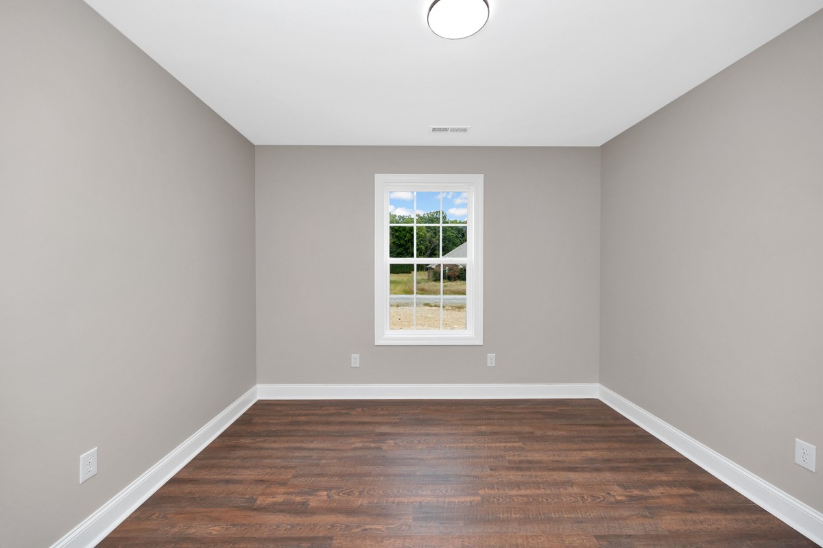 27025 North Wales Road Elkmont, AL 35620 - Photo 26 of 40 a view of an empty room with wooden floor and a window