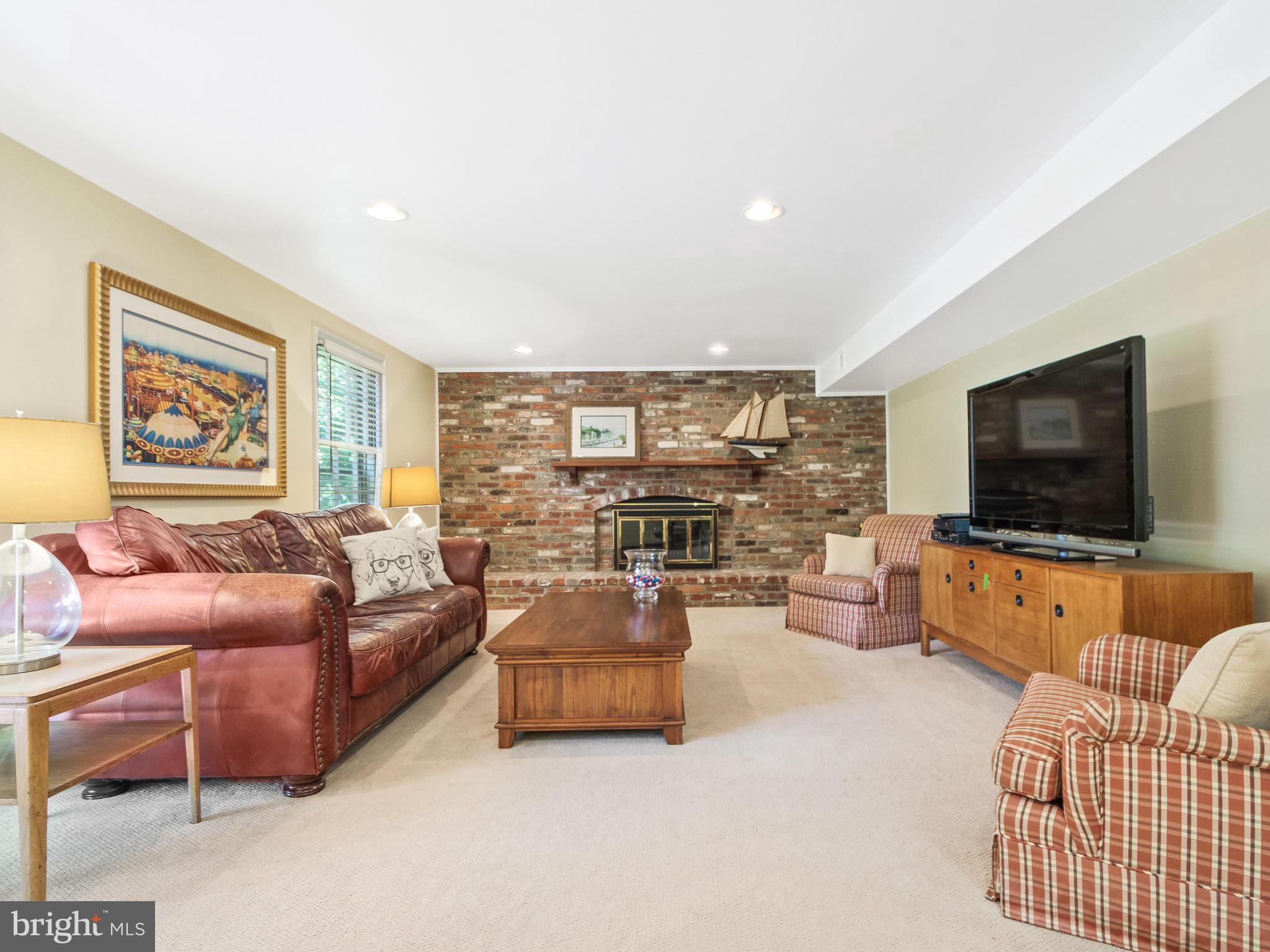 11327 Rolling House Road Rockville, MD 20852 - Photo 20 of 51 Large Family Room with Brick Fireplace