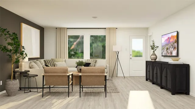 a living room with furniture and large windows