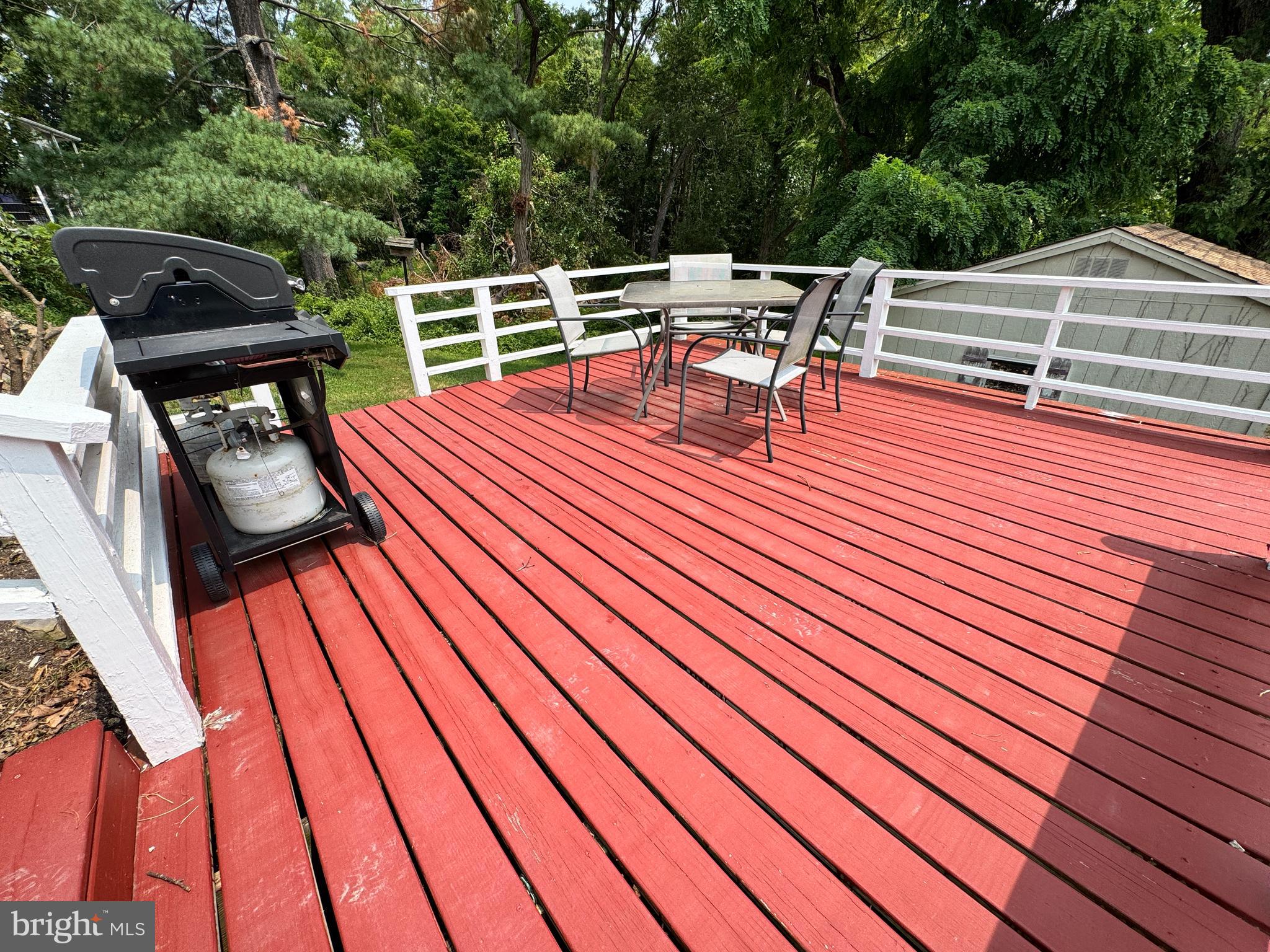 5667 Old York Road, Unit 12 New Hope, PA 18938 - Photo 15 of 17 a roof deck with a table and chairs