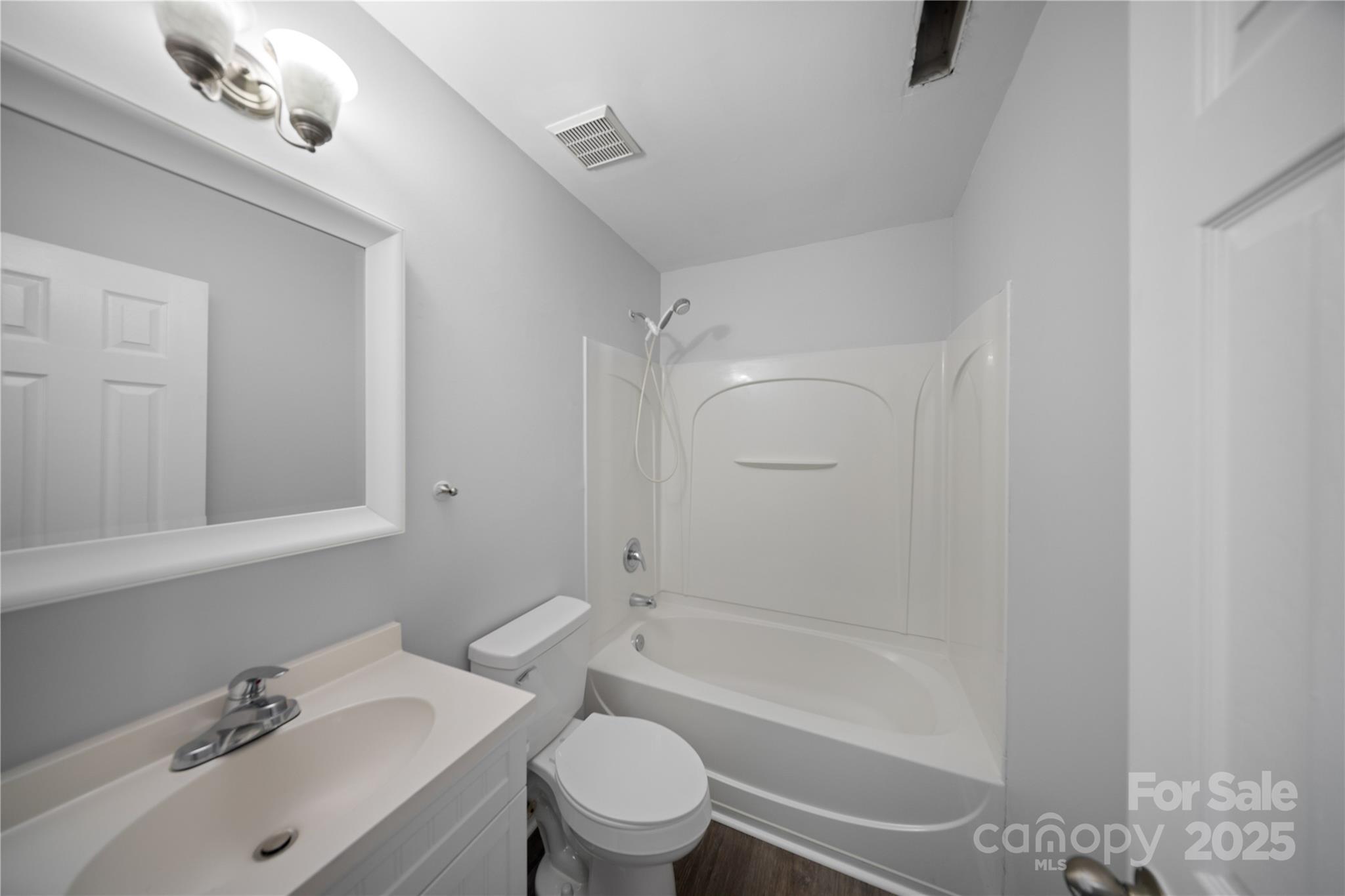 3056 Rocket Road Rock Hill, SC 29732 - Photo 12 of 33 a bathroom with a sink mirror bathtub and toilet