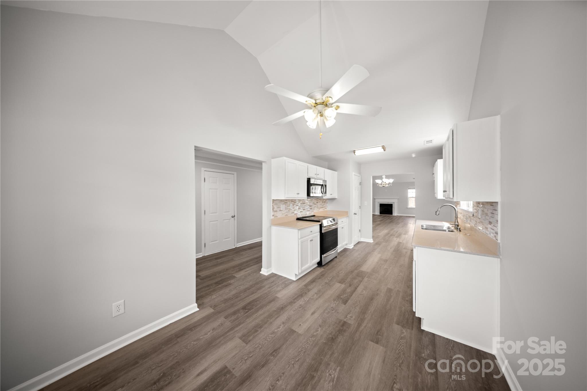 3056 Rocket Road Rock Hill, SC 29732 - Photo 10 of 33 a view of a kitchen with a sink dishwasher a kitchen counter top space and cabinets