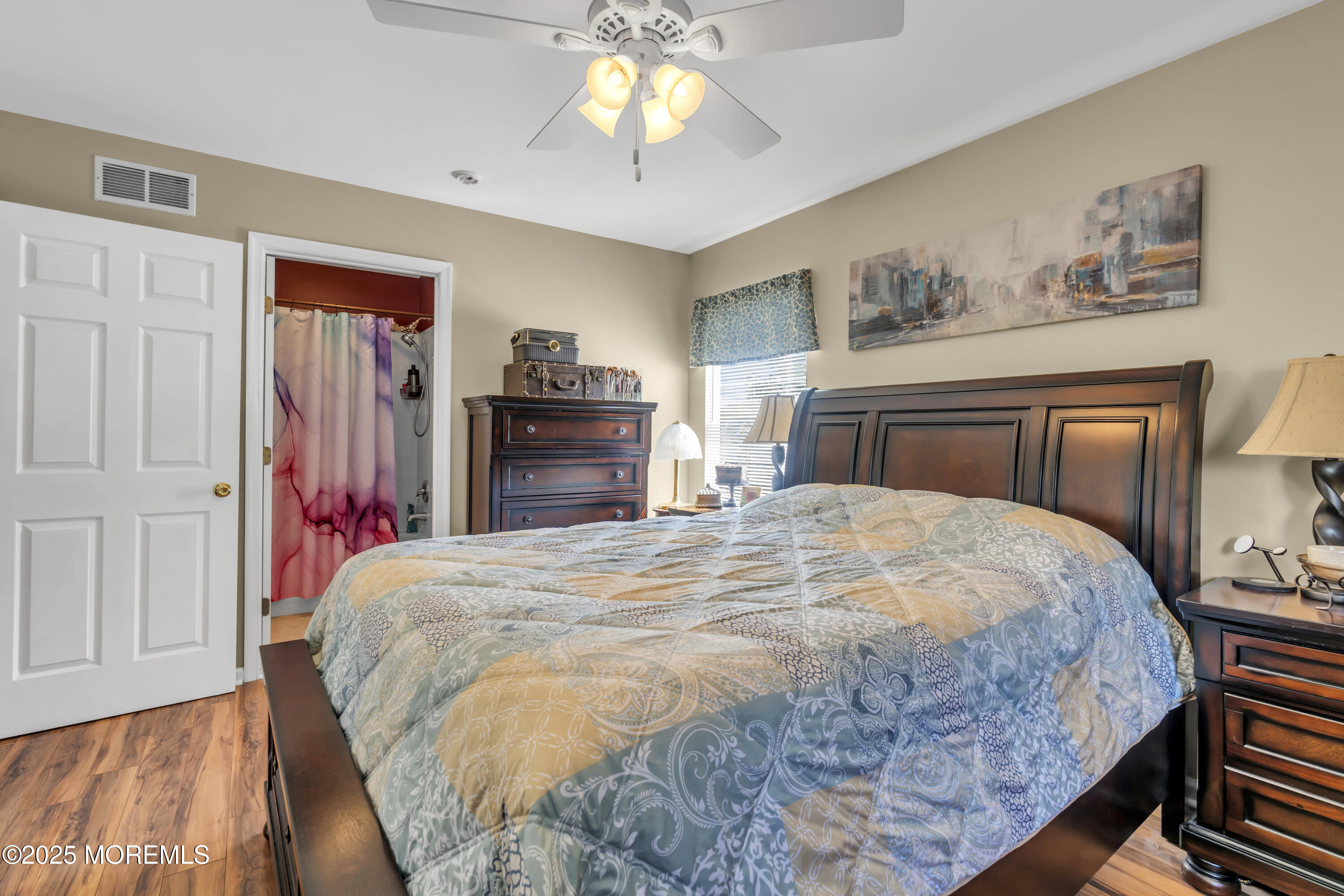 19 Sally Street Howell, NJ 07731 - Photo 13 of 31 a bedroom with a bed and a chandelier