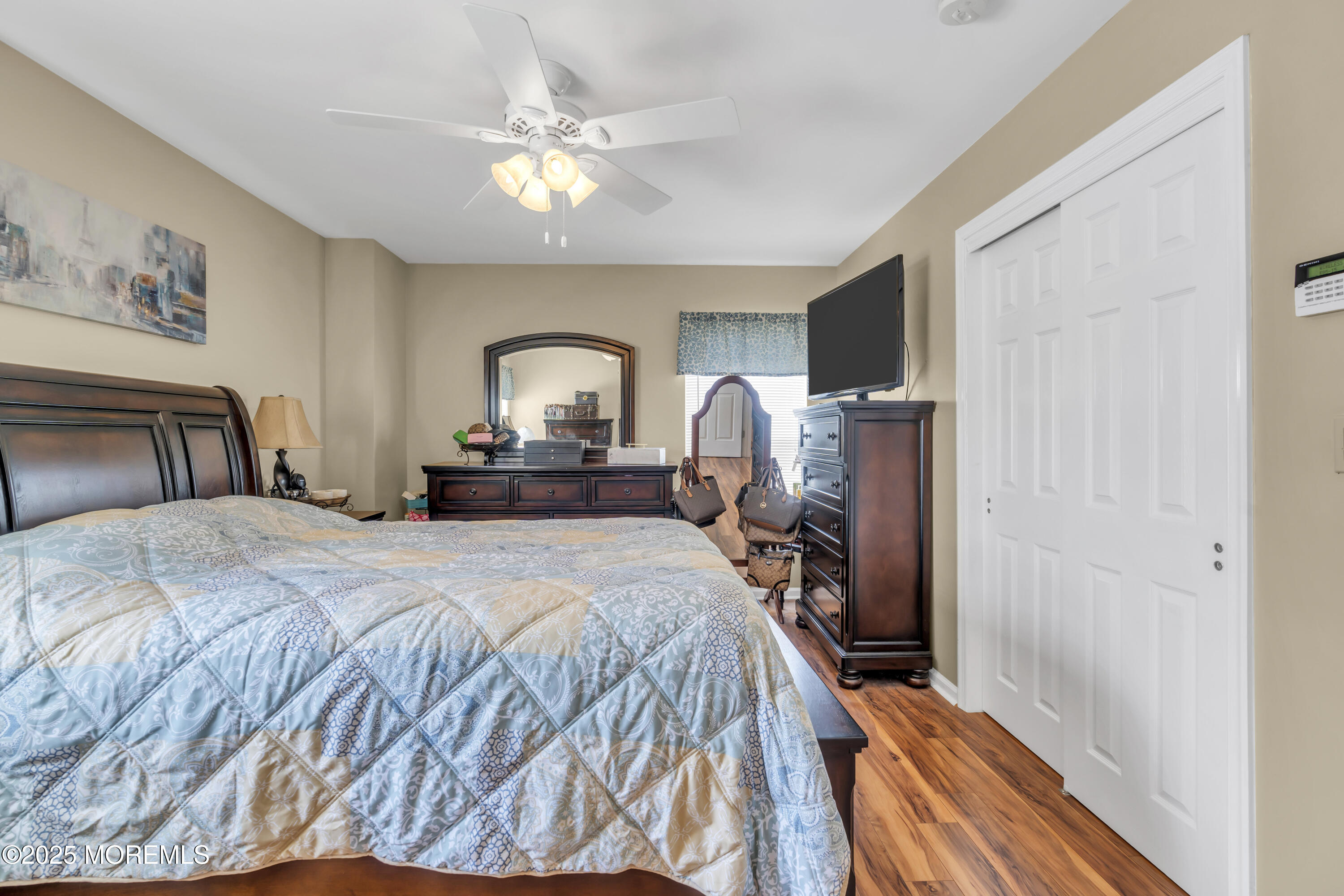 19 Sally Street Howell, NJ 07731 - Photo 15 of 31 a bedroom with a bed and a chandelier