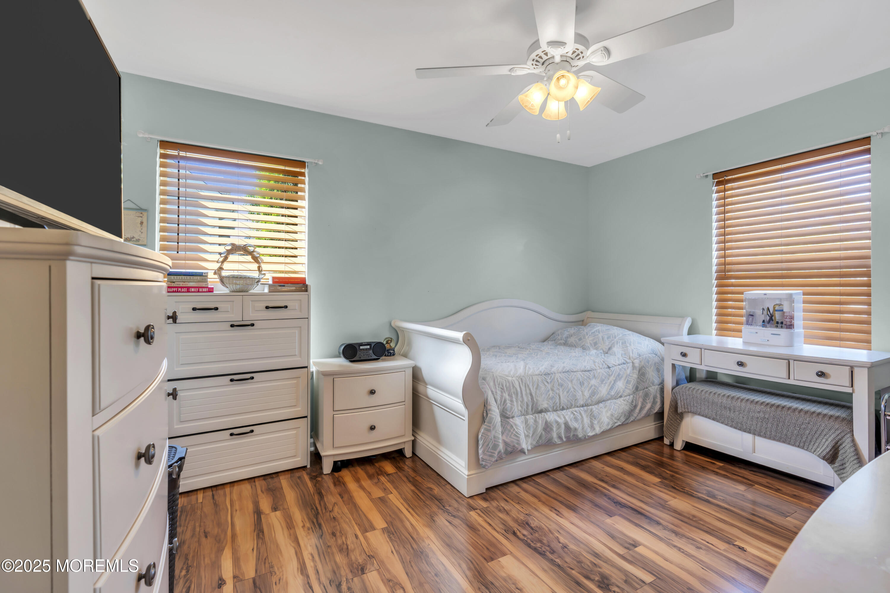 19 Sally Street Howell, NJ 07731 - Photo 16 of 31 a bedroom with a bed and a chandelier
