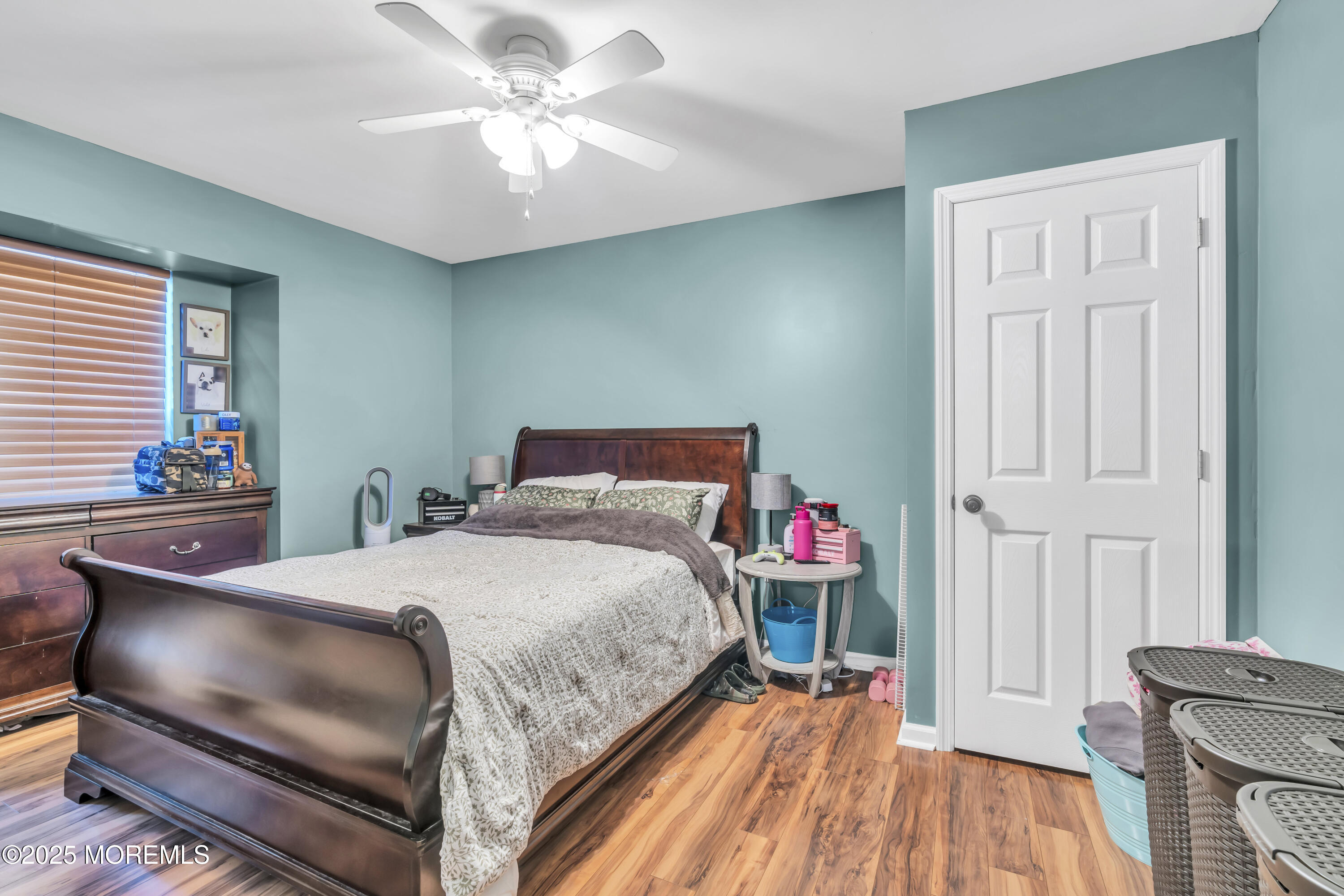 19 Sally Street Howell, NJ 07731 - Photo 22 of 31 a bedroom with a bed and a chandelier