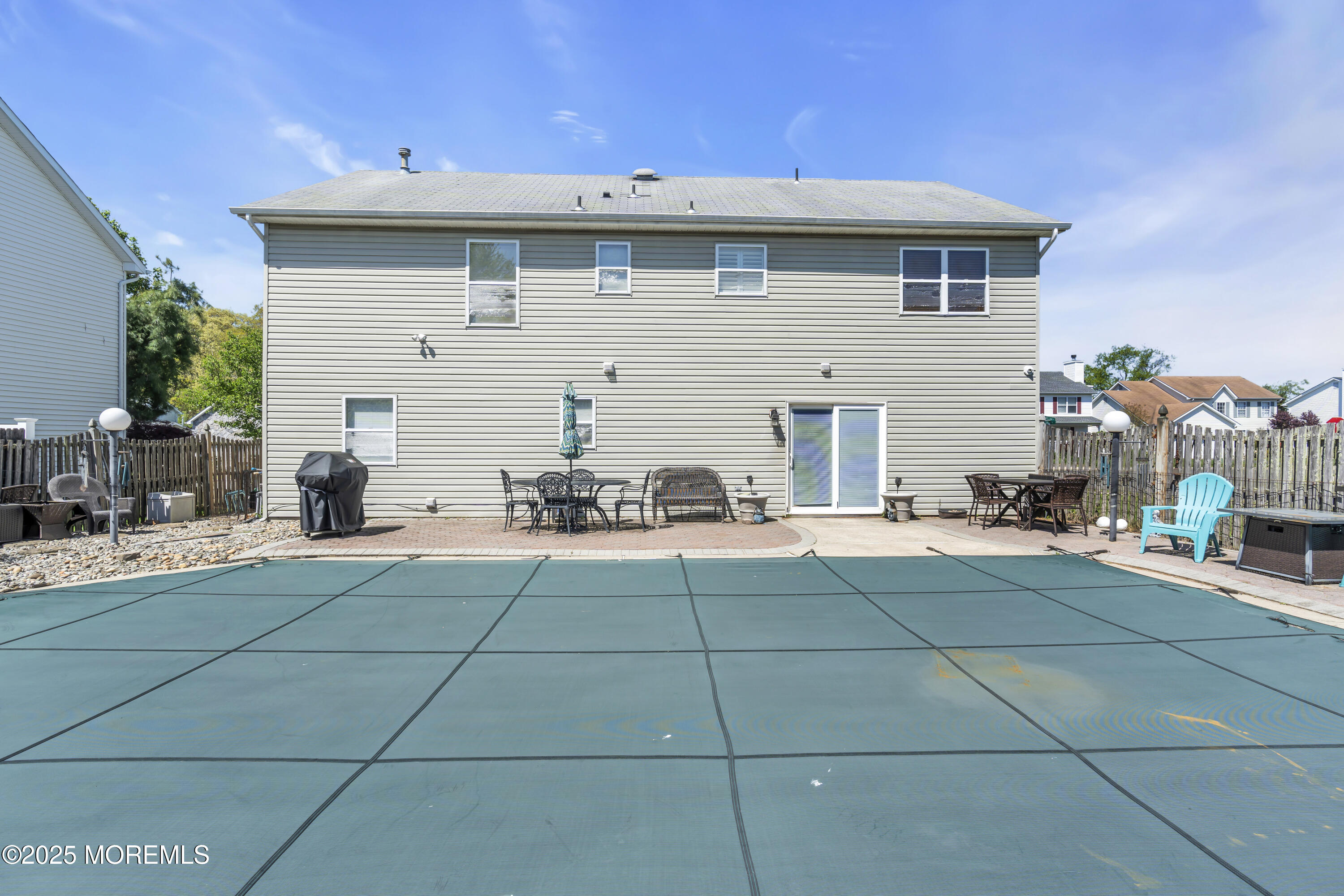 19 Sally Street Howell, NJ 07731 - Photo 28 of 31 a view of a patio with dining table and chairs with potted plants