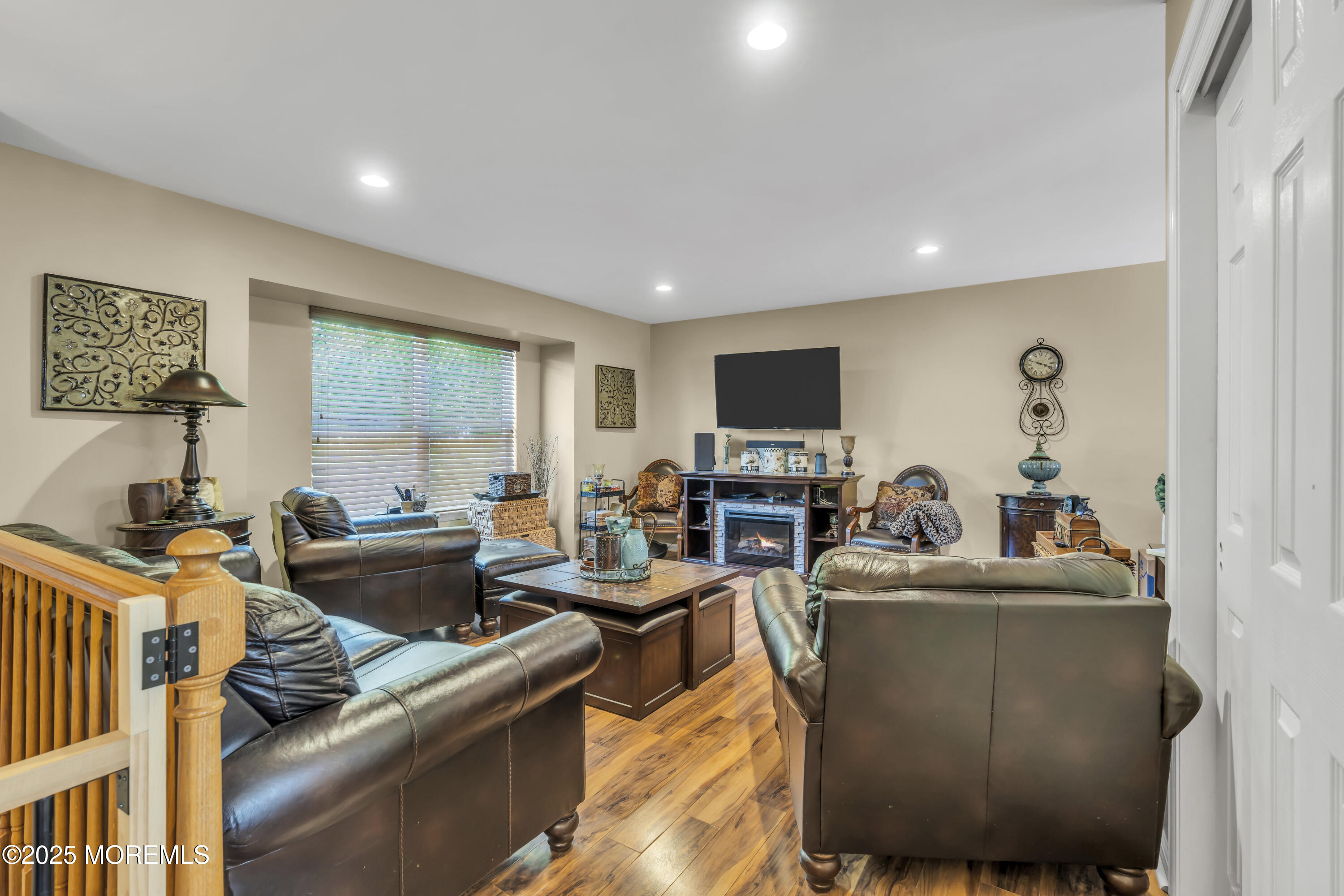 19 Sally Street Howell, NJ 07731 - Photo 4 of 31 a living room with furniture and a flat screen tv