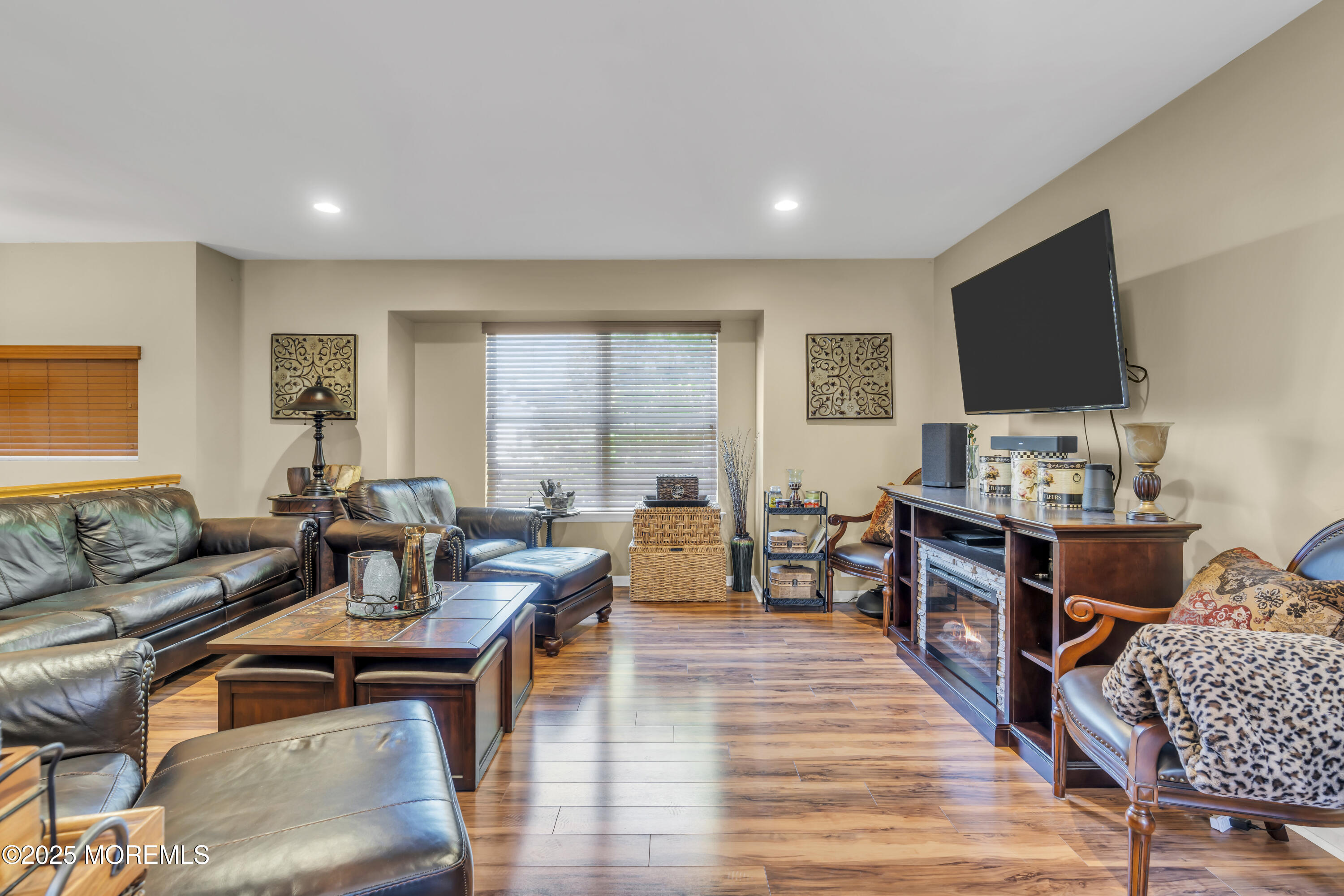 19 Sally Street Howell, NJ 07731 - Photo 5 of 31 a living room with furniture and a flat screen tv