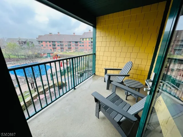 a bedroom with two beds and a window