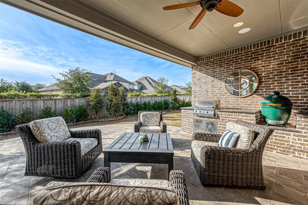 a view of a house with backyard porch and sitting area