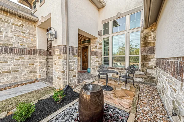 a view of a chairs and table in the patio