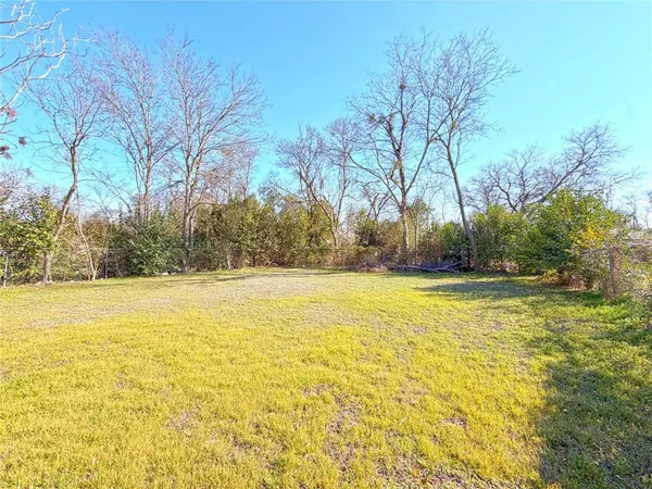 a view of yard and swimming pool