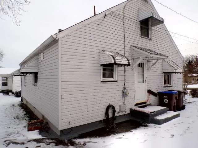 a view of a back yard of the house