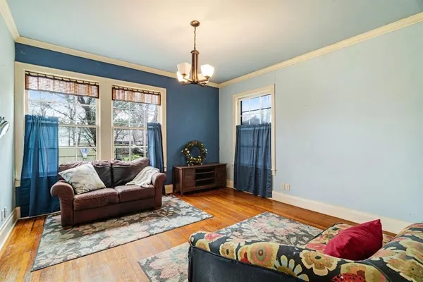 a bedroom with furniture and a ceiling fan