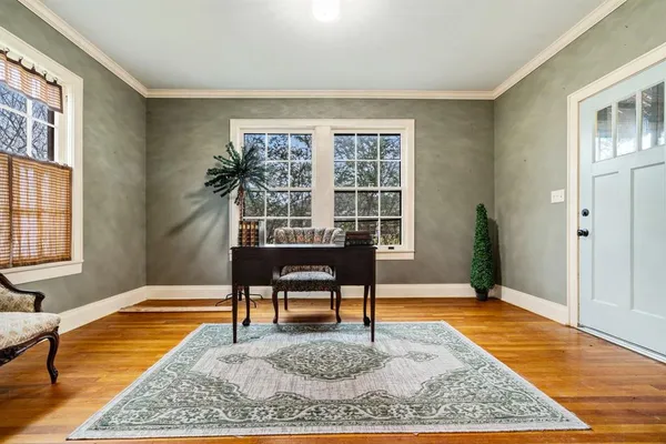 a living room with furniture and a rug