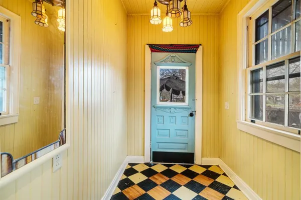 a view of a front door of house and a window