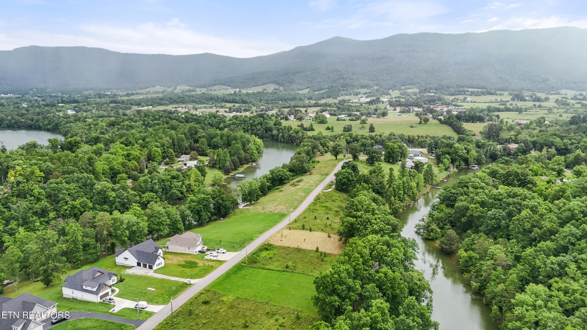 0 Wagon Lane Speedwell, TN 37870 - Photo 5 of 13 a view of a lush green hillside and houses