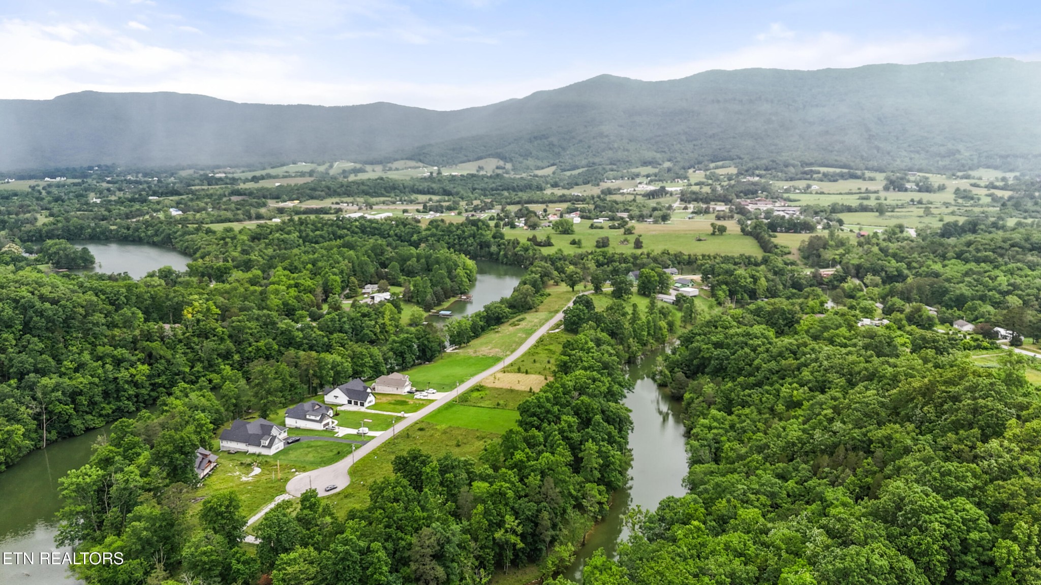 0 Wagon Lane Speedwell, TN 37870 - Photo 6 of 13 a view of a lush green hillside and houses