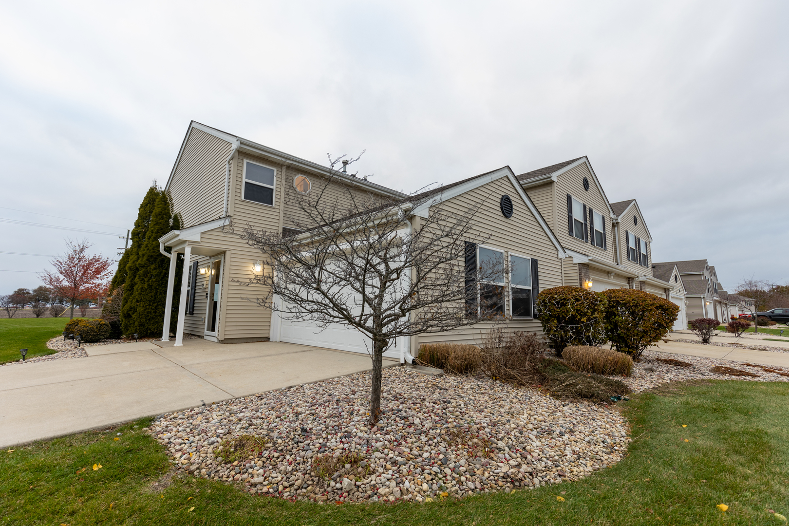 25101 Faraday Road Manhattan, IL 60442 - Photo 1 of 26 a front view of a house with a yard