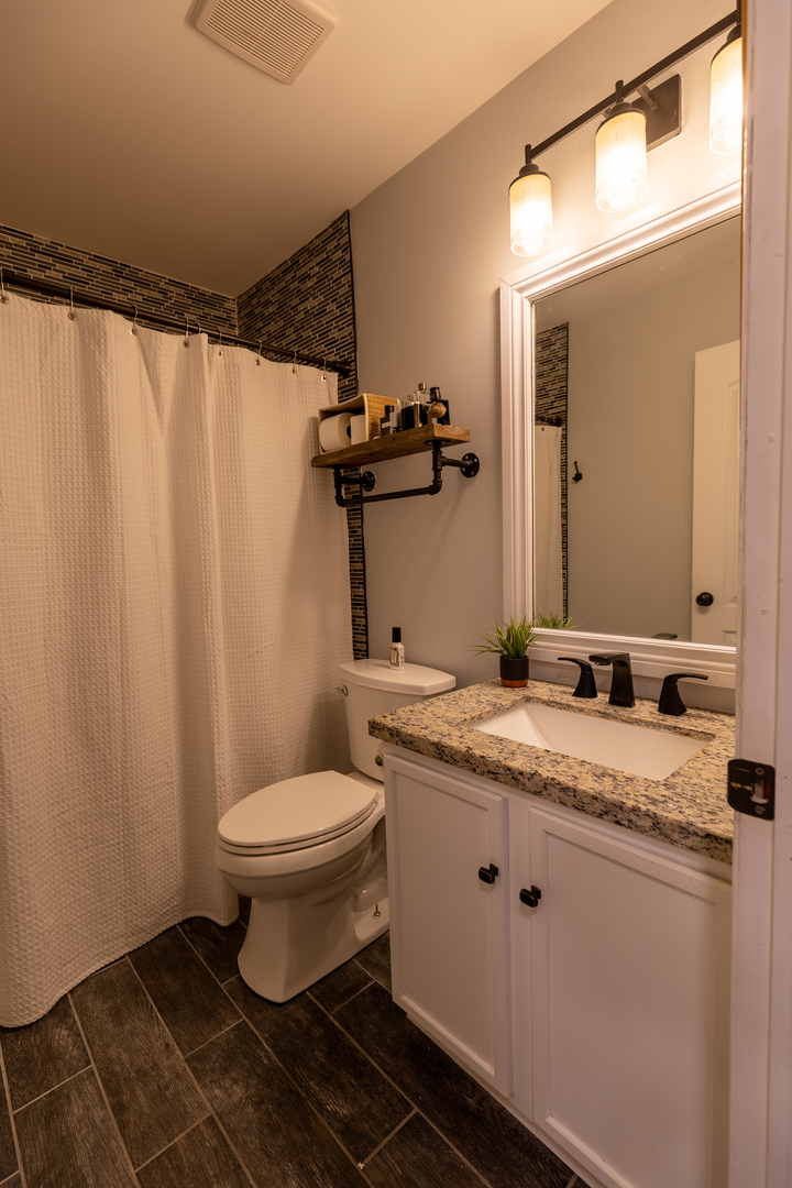 25101 Faraday Road Manhattan, IL 60442 - Photo 11 of 26 a bathroom with a granite countertop sink and a mirror