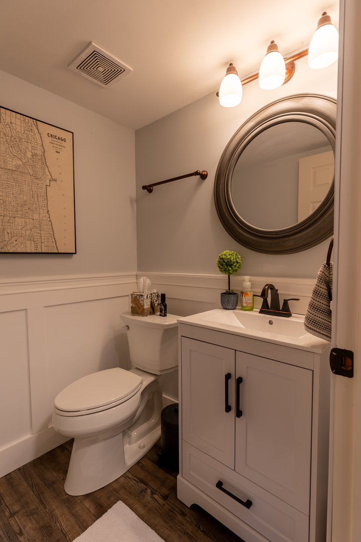 25101 Faraday Road Manhattan, IL 60442 - Photo 14 of 26 a bathroom with a toilet mirror vanity and a sink