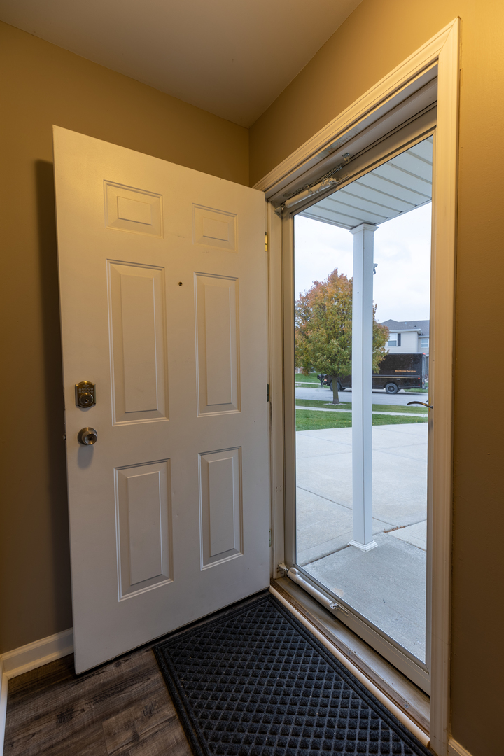 25101 Faraday Road Manhattan, IL 60442 - Photo 20 of 26 a view of a door and wooden floor