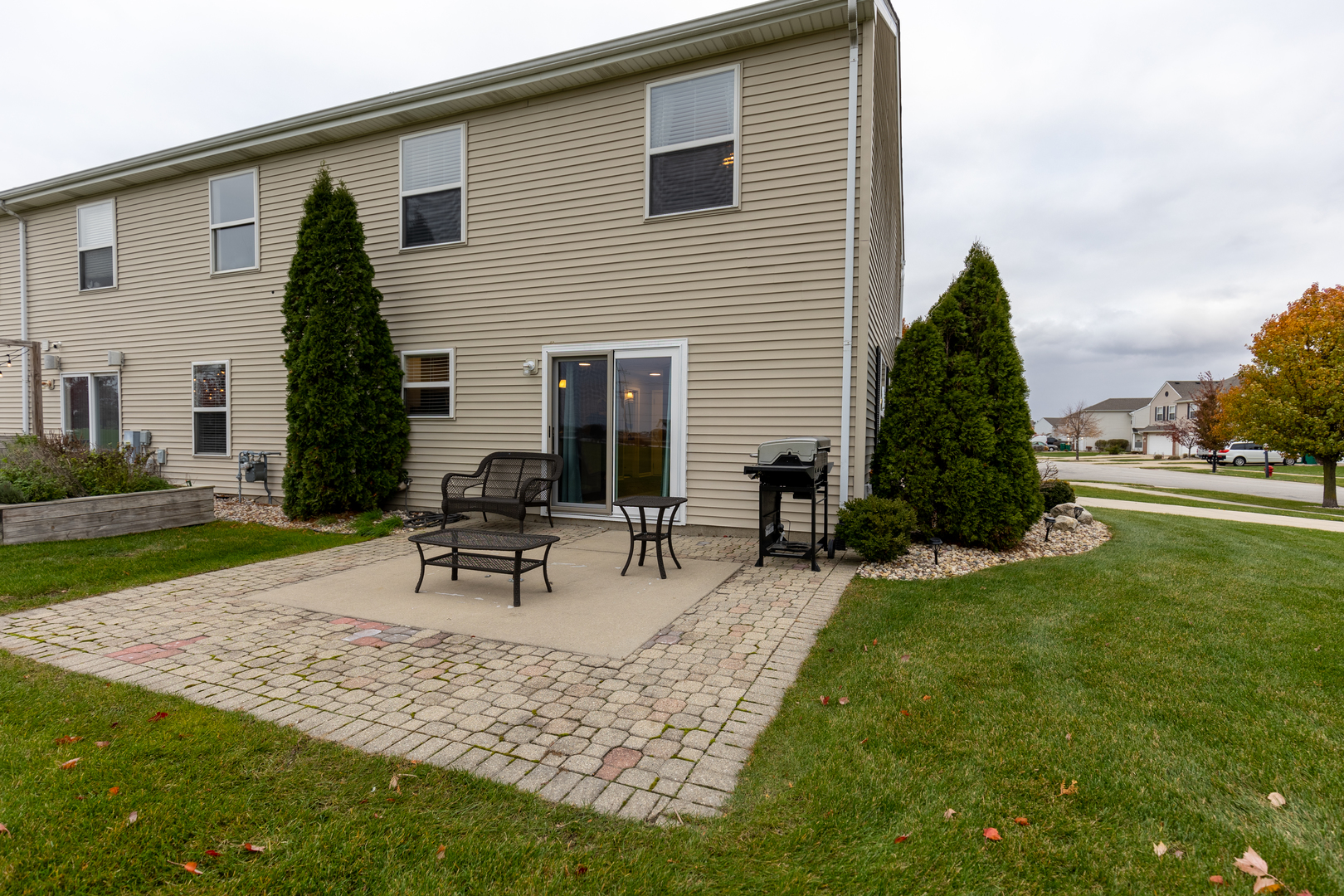 25101 Faraday Road Manhattan, IL 60442 - Photo 21 of 26 a view of a house with backyard sitting area and garden