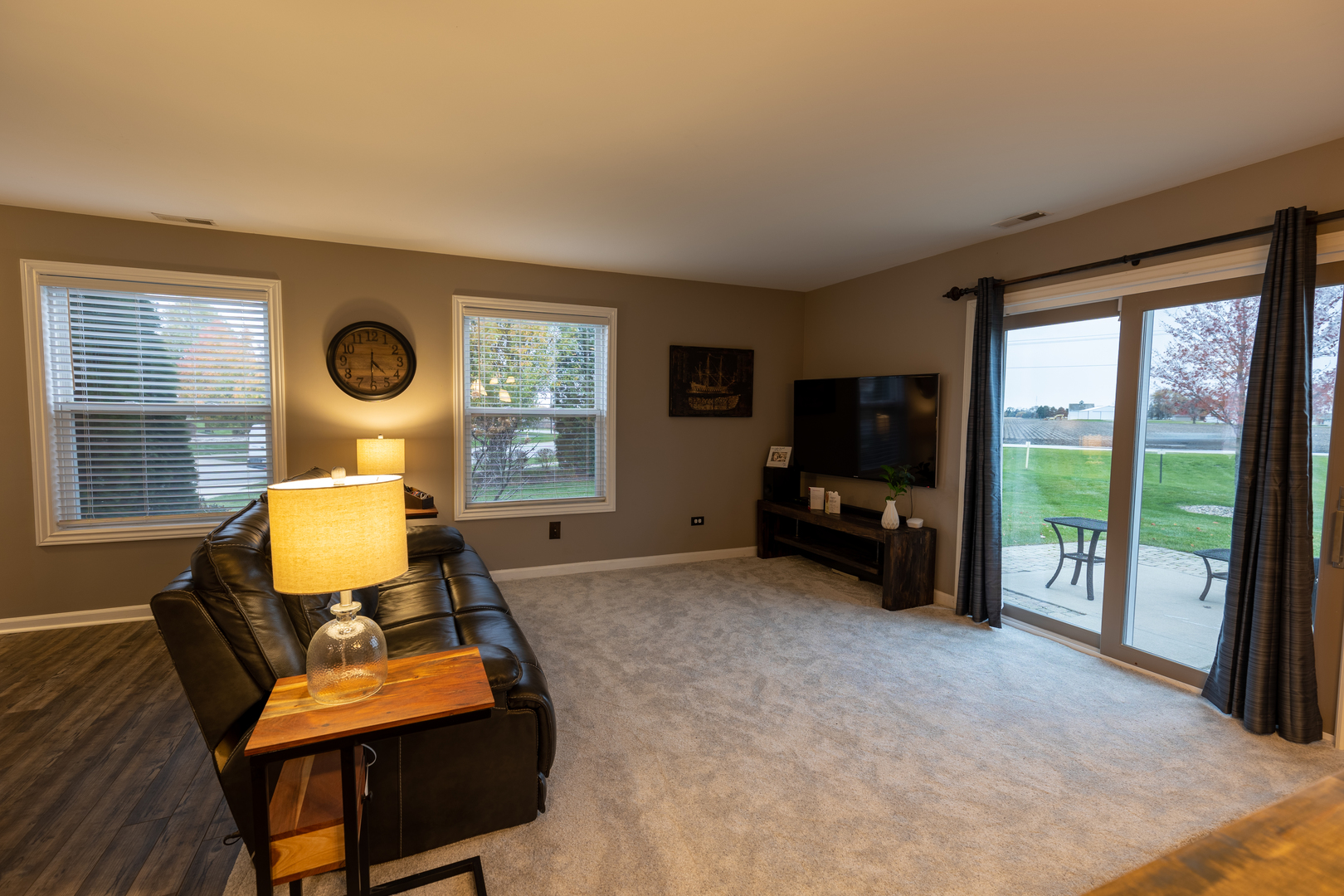 25101 Faraday Road Manhattan, IL 60442 - Photo 8 of 26 a living room with furniture and a flat screen tv