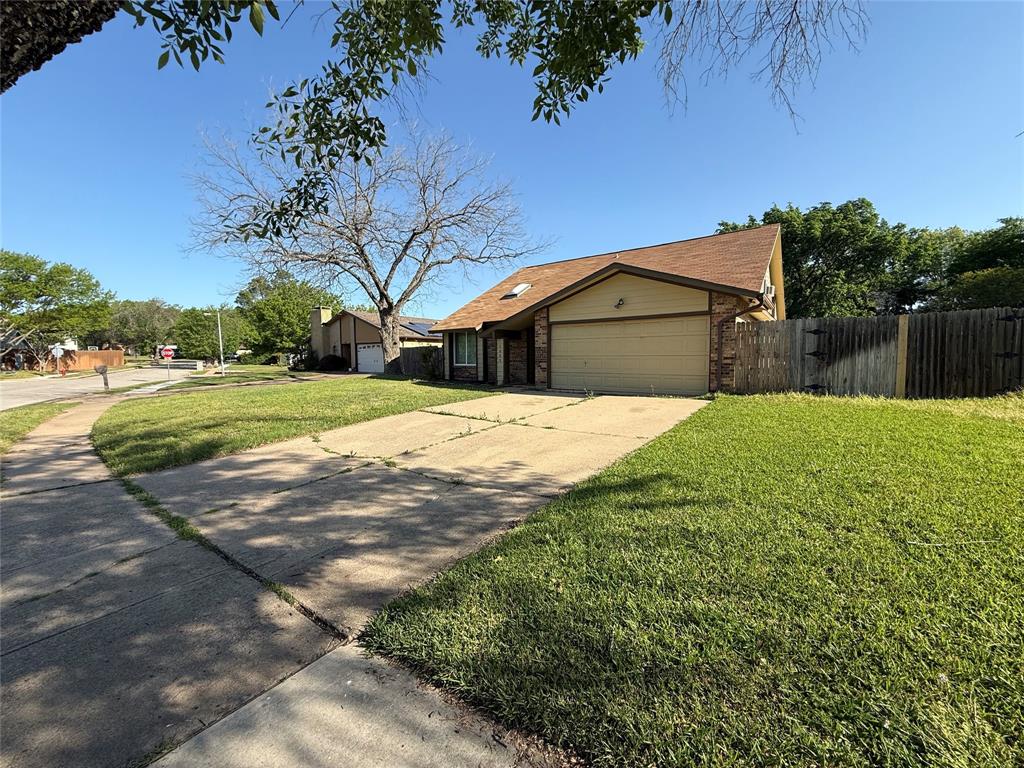 3005 Meandering Way Bedford, TX 76021 - Photo 19 of 22 a view of a yard with a house in the background