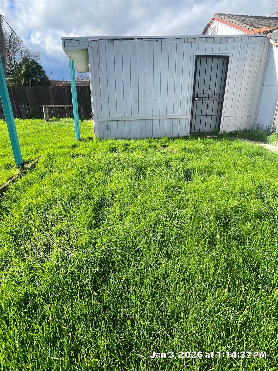 450 Lilac Lane Rio Linda, CA 95673 - Photo 12 of 12 a view of backyard with potted plants and wooden fence