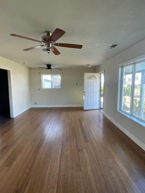 450 Lilac Lane Rio Linda, CA 95673 - Photo 2 of 12 a view of an empty room with wooden floor and a window