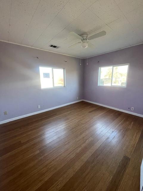 450 Lilac Lane Rio Linda, CA 95673 - Photo 8 of 12 an empty room with wooden floor and windows