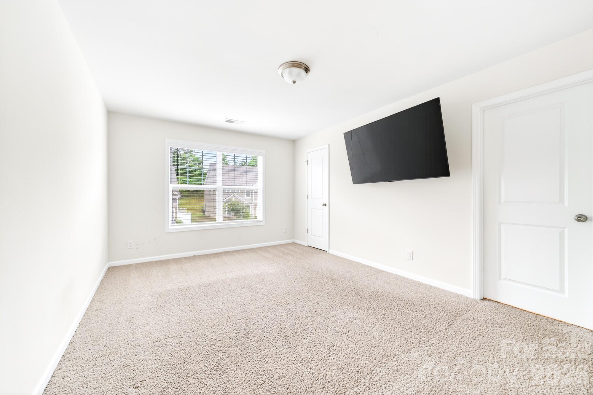 5972 Redwood Pine Road Concord, NC 28027 - Photo 30 of 37 a view of a livingroom with a flat screen tv