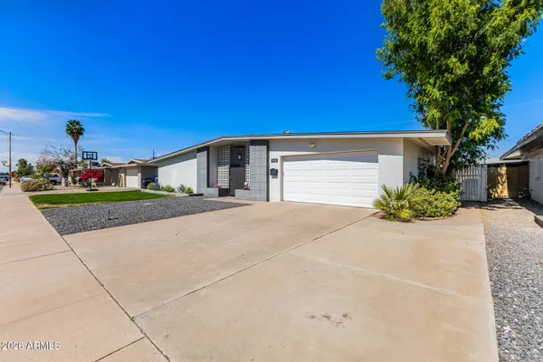 a view of garage and yard