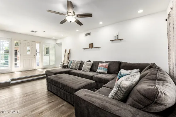 a living room with furniture and a large window