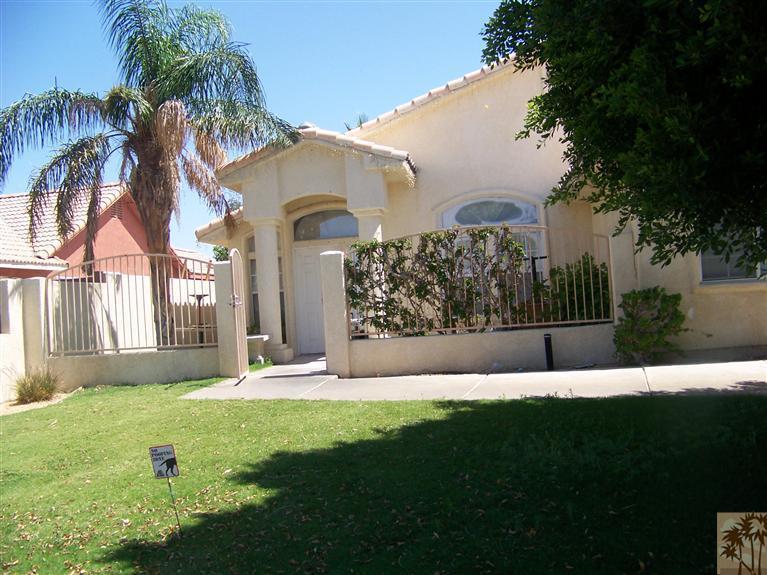 68220 Santelmo Road Cathedral City, CA 92234 - Photo 1 of 21 a front view of a house with garden