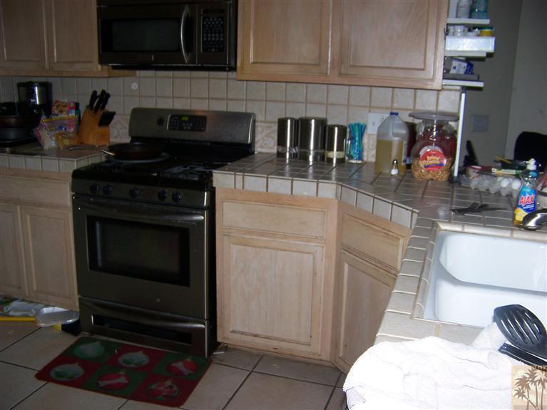 68220 Santelmo Road Cathedral City, CA 92234 - Photo 13 of 21 a kitchen with appliances and cabinets